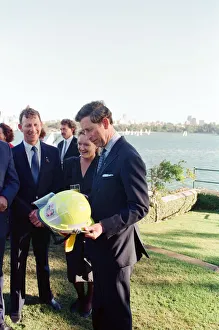 Prince Charles in Sydney, pictured holding a fire fighters helmet. Sydney, Australia