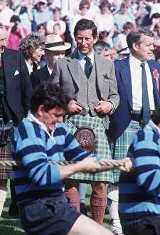 00185 Prints: Prince Charles watching the tug of war at the Braemar Highland Games September 1989
