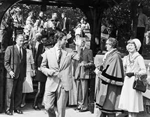 Suit Prints: Prince Charles waves to the crowds after visiting Marton Church where he saw