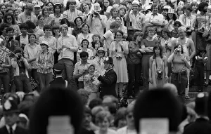 00192 Prints: Prince Charles wedding day with policeman July 119981 dancing in street with a member of