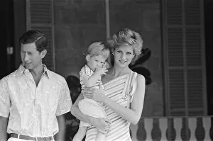 Images Dated 12th August 1986: Prince Harry and his mother HRH Princess Diana, the Princess of Wales are on holiday with
