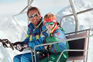 Prince Harry pictured on a ski chair lift during a ski holiday with Prince Charles