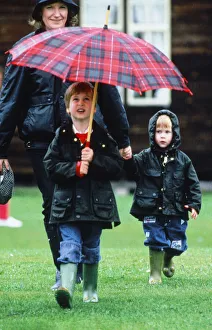 Prince Harry at rear with his brother Prince William at polo at Cirencester June
