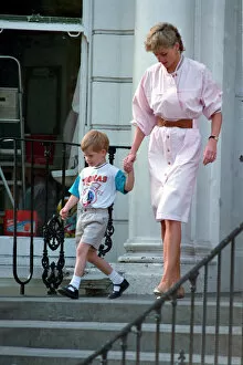 Images Dated 1st June 1989: Prince Harry wears a Thomas the Tank Engine tee-shirt when he leaves nursery school with