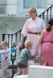 Diana Prints: Prince Harry wears a Thomas the Tank Engine tee-shirt when he leaves nursery school with