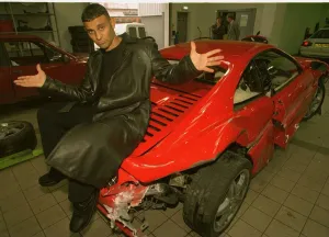 Prince Naseem sitting on smashed ferrari Sheffield garage