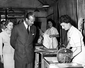 Prince Philip, Duke of Edinburgh at the Empire Village watching washing machines for