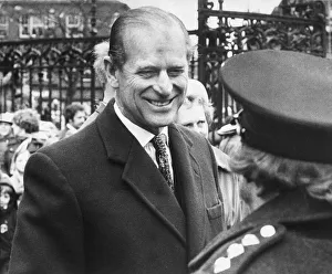 Prince Philip, Duke of Edinburgh, greets the crowd as he leaves Carlisle Cathedral