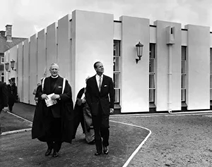 Prince Philip, Duke of Edinburgh, leaves the new library with the principal