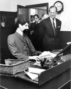 Dummy Prints: Prince Philip, Duke of Edinburgh, is met with a stony stare from the dummy behind
