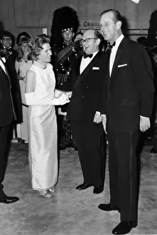 Prince Philip. The Duke of Edinburgh with Mr and Mrs Peter Scott at the premiere of