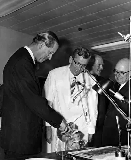 Dentist Prints: Prince Philip, the Duke of Edinburgh, risks a finger as he examines a realistically