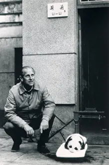 Prince Philip, Duke of Edinburgh, seen here with panda cub Li Li during his visit to