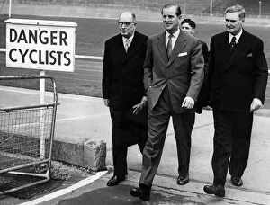 Prince Philip, Duke of Edinburgh is seen walking with Dr Anthony Steel and Mr G