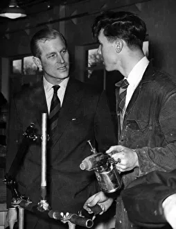 Prince Philip, Duke of Edinburgh talks to plumbing student Peter Hawkins