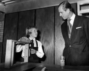 Prince Philip, Duke of Edinburgh talks to Timothy McCann during his tour of the art