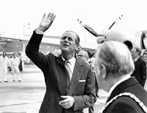 01359 Collection: Prince Philip, Duke of Edinburgh waves to a party of happy school children who were