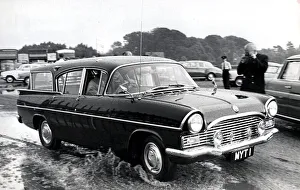 01440 Prints: Prince Philip leaving Smiths field polo ground in his car after a storm. June 1963