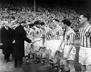 Prince Philip shakes hands with the Aston Villa team May 1957 before the Aston