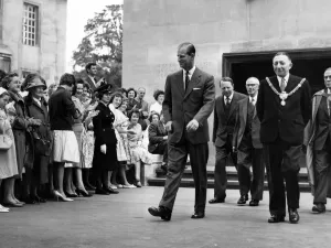 01037 Prints: Prince Philip visiting Wales. A smiling Duke of Edinburgh leaves the college after