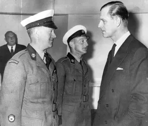 01430 Prints: Prince Phillip president of the a with two patrol men who received a medals for