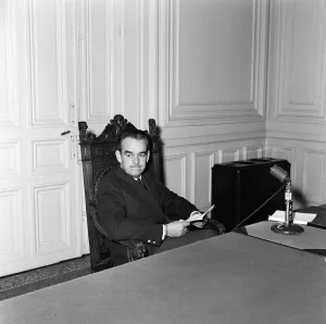 Prince Rainier of Monaco holds a press conference before the birth of his first baby