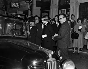 Prince Rainier and Princess Grace of Monaco leave the Apollo Theatre after watching