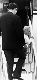 Images Dated 8th September 1984: Prince William with Prince Charles at Aberdeen Airport, climbing the stairway to