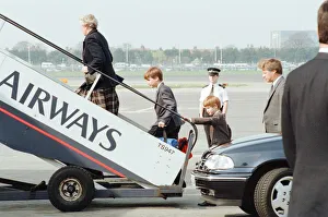 01138 Prints: Prince William and Prince Harry board aircraft at London Heathrow Airport