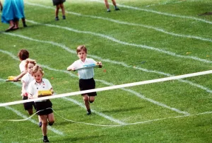 00127 Prints: Prince William at his school sports day at Richmond Sports Stadium taking part in an Egg