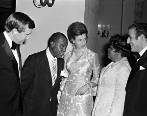 Princess Alexandra meets Louis Armstrong at a private party at the Savoy Hotel, London