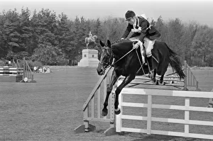 Princess Anne, The Princess Royal, competing in a showjumping event t Windsor Great Park