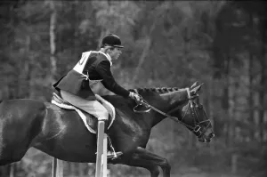 Princess Anne, The Princess Royal, competing in a showjumping event t Windsor Great Park