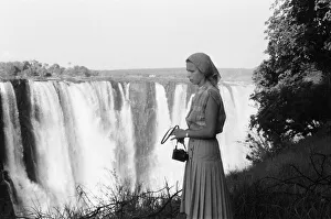 Princess Anne, stands in front of Victoria Falls during her visit to Zimbabwe