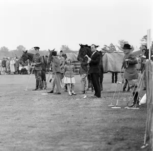 01254 Prints: Princess Anne watches her father play polo at Windsor Great Park. 17th May 1959