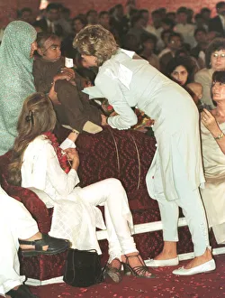 Princess Diana cradles a sick child during a visit to the Shaukat Khanum Memorial