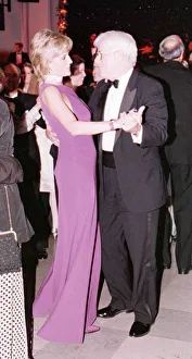 Princess Diana dances with American chat show host Phil Donahue at a charity gala dinner