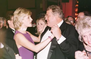 Princess Diana dances with American millionaire tool manufacturer Michael Wilkie at a