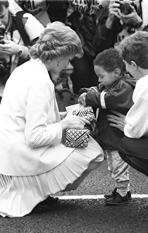 00085 Prints: Princess Diana handing out a few surprise gifts to children at the start of the 1988
