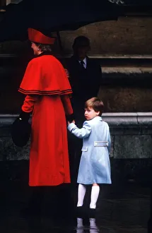 Princess Diana holding Prince William by the hand as they enter St George