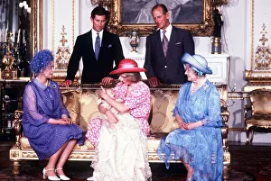 Princess Diana, holds her son Prince William in her arms in the White Drawing Room of