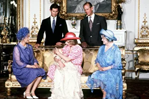 Princess Diana, holds her son Prince William in her arms in the White Drawing Room of