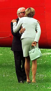 Princess Diana is kissed by Sir Richard Attenborough as she leaves Leicester University