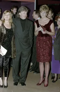 Princess Diana meeting Paul McCartney and his wife Linda after a performance of his