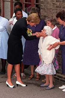 Visiting Prints: Princess Diana pays a visit to the old folks home run by the Guinness Trust at Newham in
