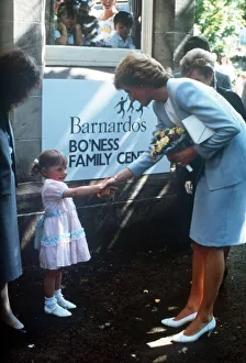 Princess Diana pictured with nursery school children during a visit to the Barnardo