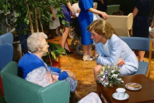 00065 Prints: Princess Diana pictured with pensioner Helen McCaffrey during a visit to the Bo