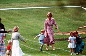 Princess Diana and Prince Harry walk along hand in hand at Prince William