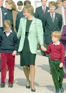 Princess Diana with Prince Harry and William board a Candian military helicopter after