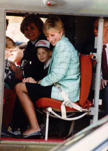Canadaroyaltour Prints: Princess Diana with Prince Harry and William board a Candian military helicopter after
